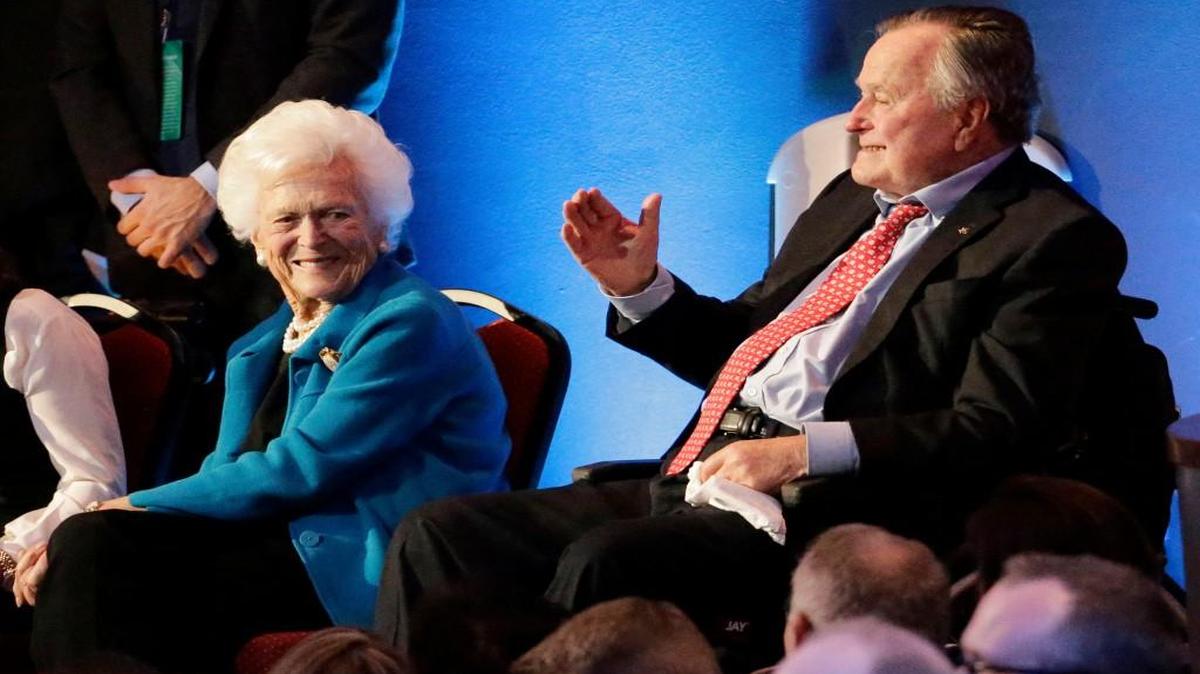 Former President George H. W. Bush, right, and his wife, Barbara, are greeted before a Republican presidential primary debate at The University of Houston in Houston. On Wednesday, Jan. 18, 2017, the former president was admitted to an intensive care unit, and Barbara was hospitalized as a precaution, according to his spokesman.