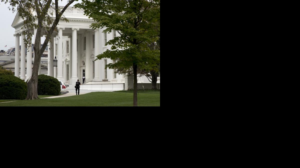 
A security member of the Secret Service approaches the North Portico of the White House in Washington Monday
