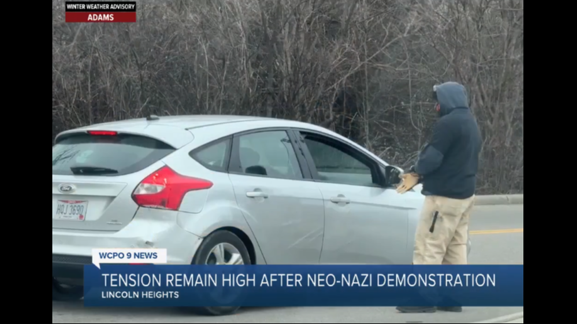 A member of the group stops a driver entering Lincoln Heights.