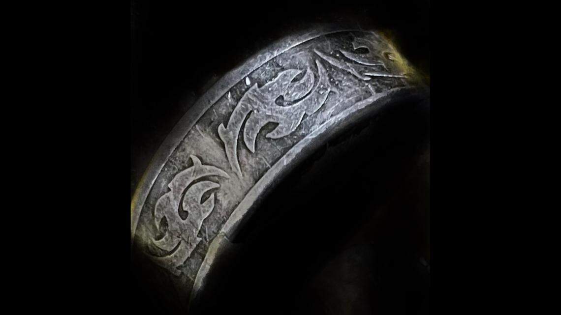 An unidentified person whose body was found floating in Lake Michigan was wearing a unique ring on their right index finger, officials say.