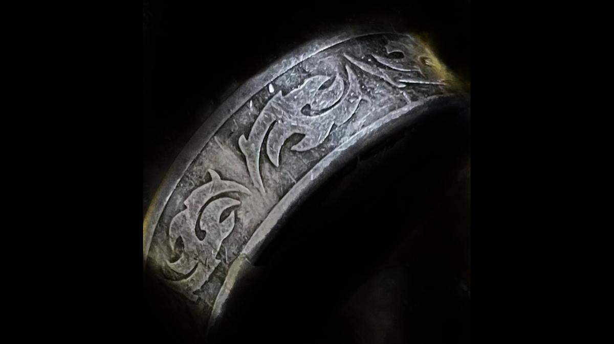 An unidentified person whose body was found floating in Lake Michigan was wearing a unique ring on their right index finger, officials say.