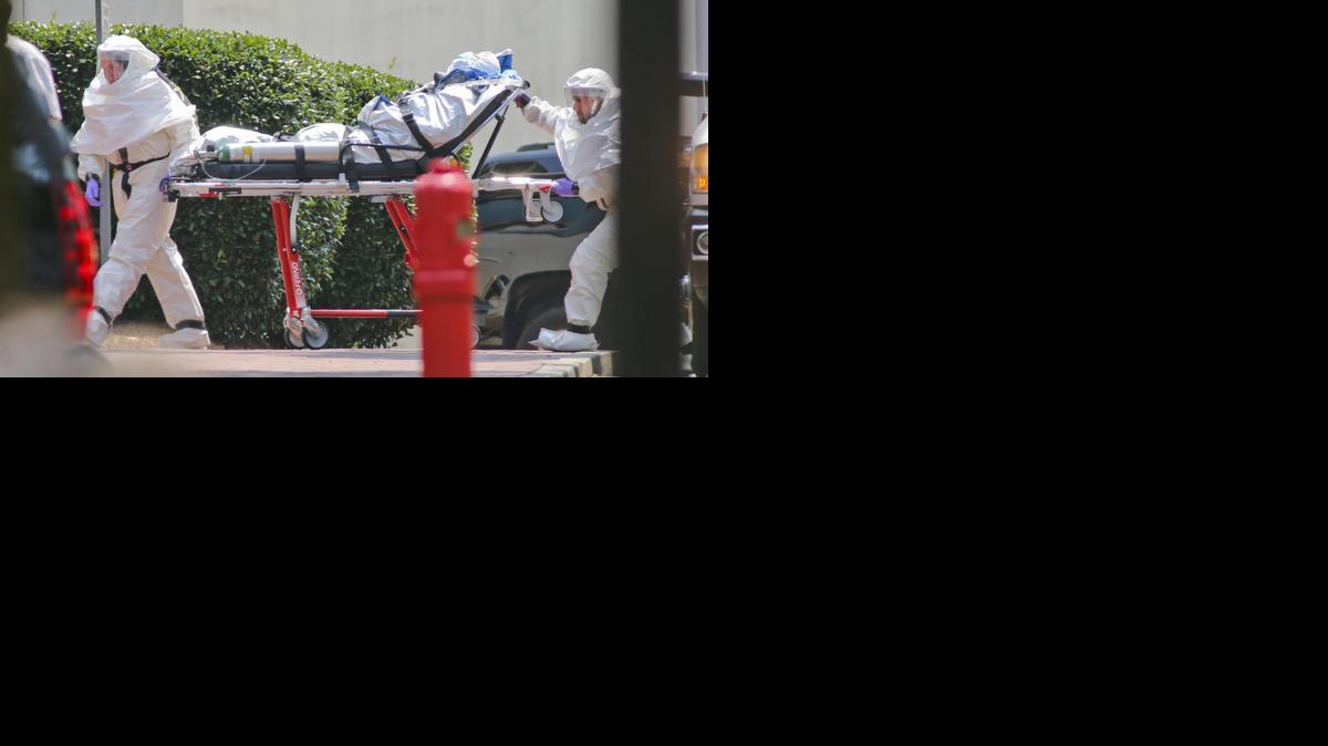
Medical workers rolled patient Nancy Writebol, the second American aid worker infected with Ebola, into Emory University Hospital in Atlanta on Tuesday.
