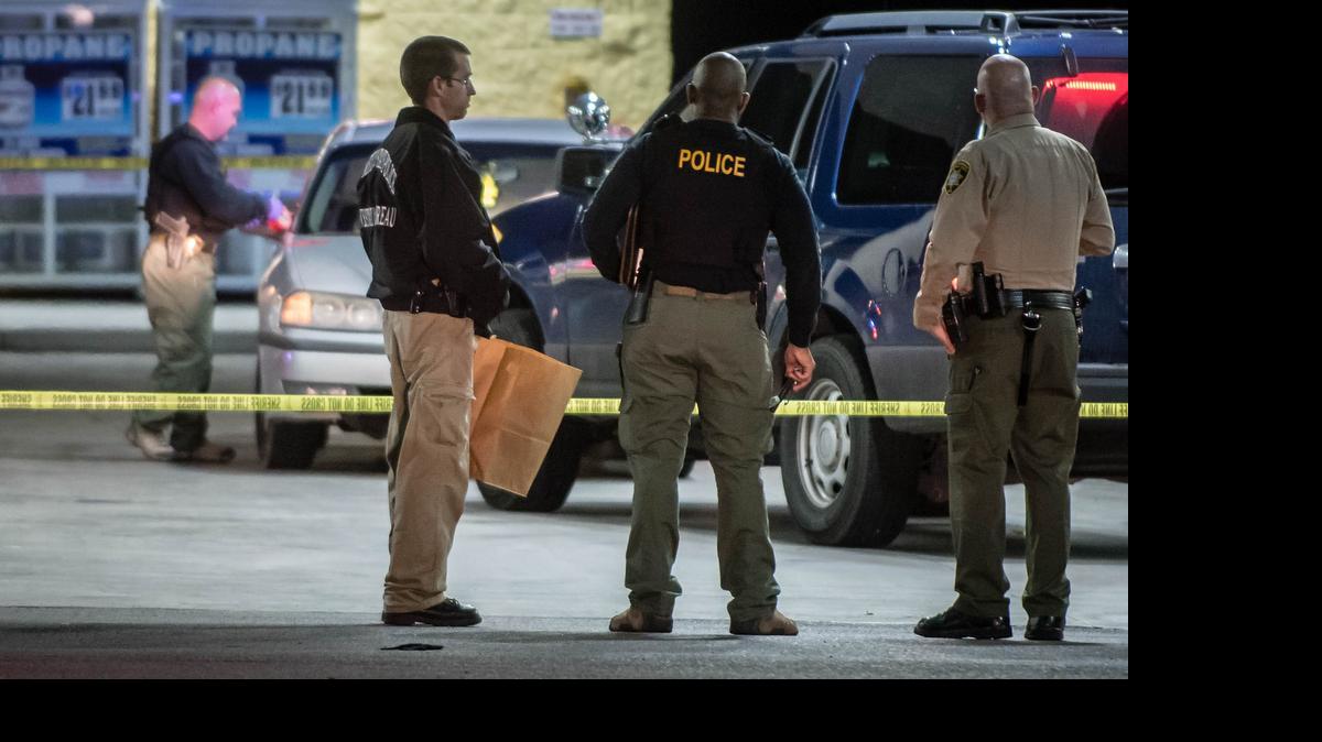 
New Mexico State Police and Bernalillo County Deputies collect evidence at the scene where an alleged suspect involved in the fatal shooting of a Rio Rancho officer Sunday evening was apprehended Tuesday
