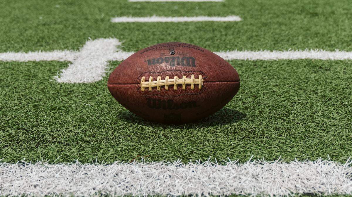A man was arrested after being accused of punching two spectators at a high school football game, Ohio cops say.