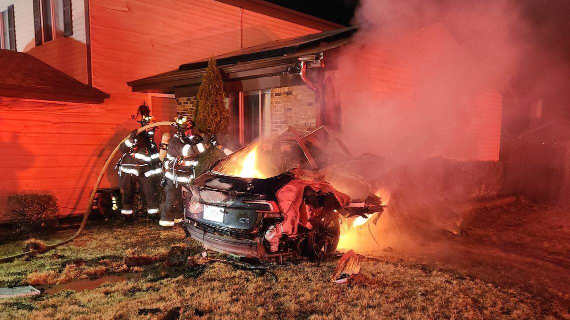 Two people died when a driver crashed a Tesla into a home, causing a fiery scene, authorities say.