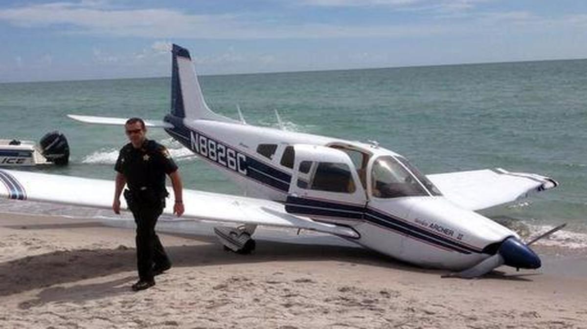 
Emergency personnel at the scene of a small plane crash in Caspersen Beach in Venice, Fla. 
