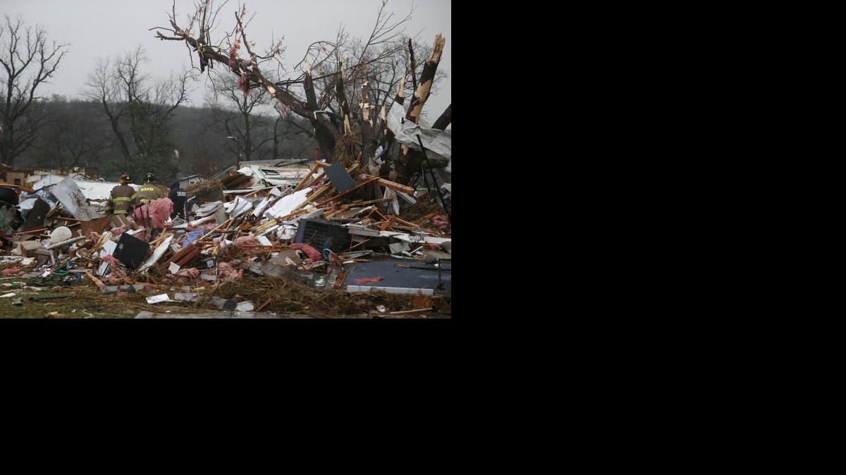 
First responders work to free a man from a rubble pile after a round of severe weather hit a trailer park near Tulsa, Oklahoma.
