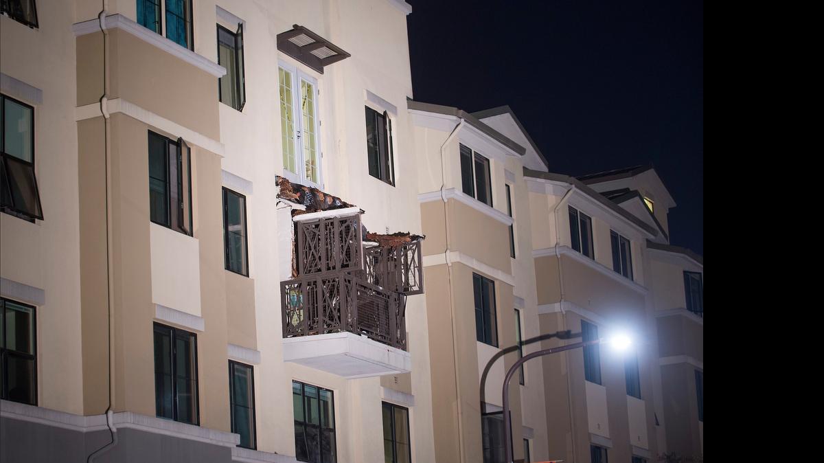 
A fourth floor balcony rests on the balcony below it after collapsing at the Library Gardens apartment complex in Berkeley, Calif.
