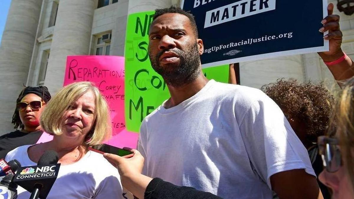 Corey Menafee, a dishwasher at Yale’s Calhoun College, talked to the press after he destroyed a stained-glass window pane depicting black slaves picking cotton.