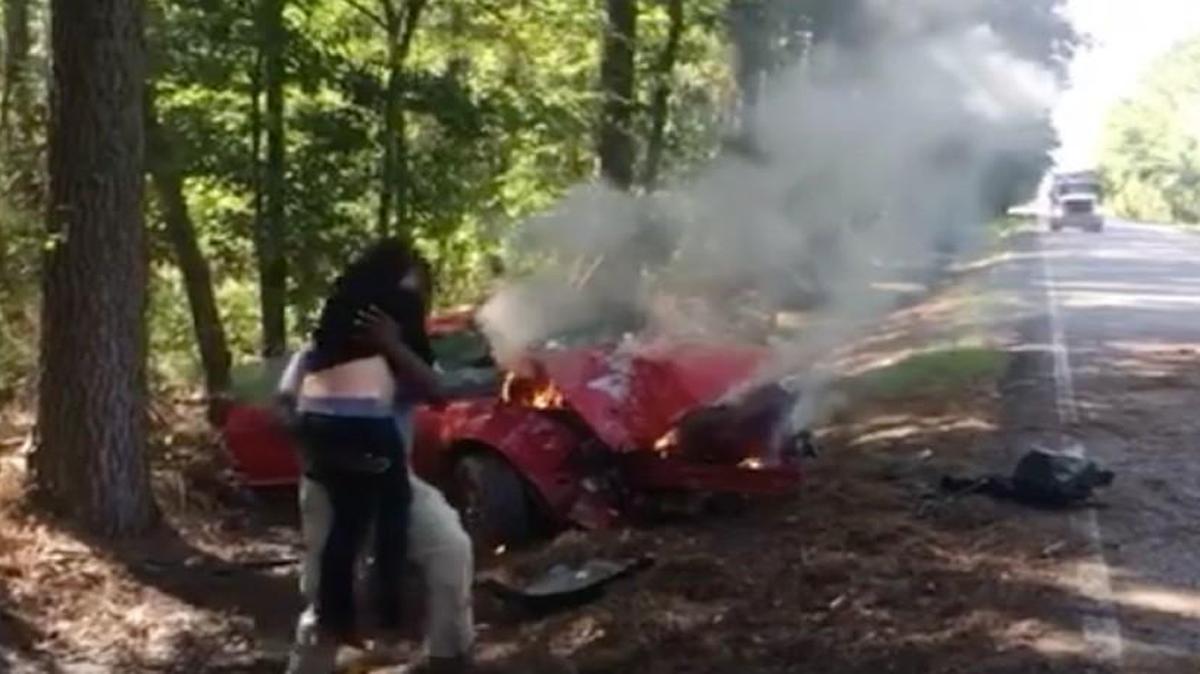 TV photographer Patrick Perry pulled a pregnant woman from a burning car in Louisiana on Tuesday.
