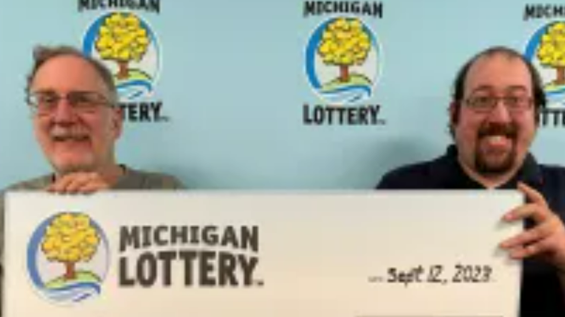 Gary Mallet and Tim Mallet with their oversized check.