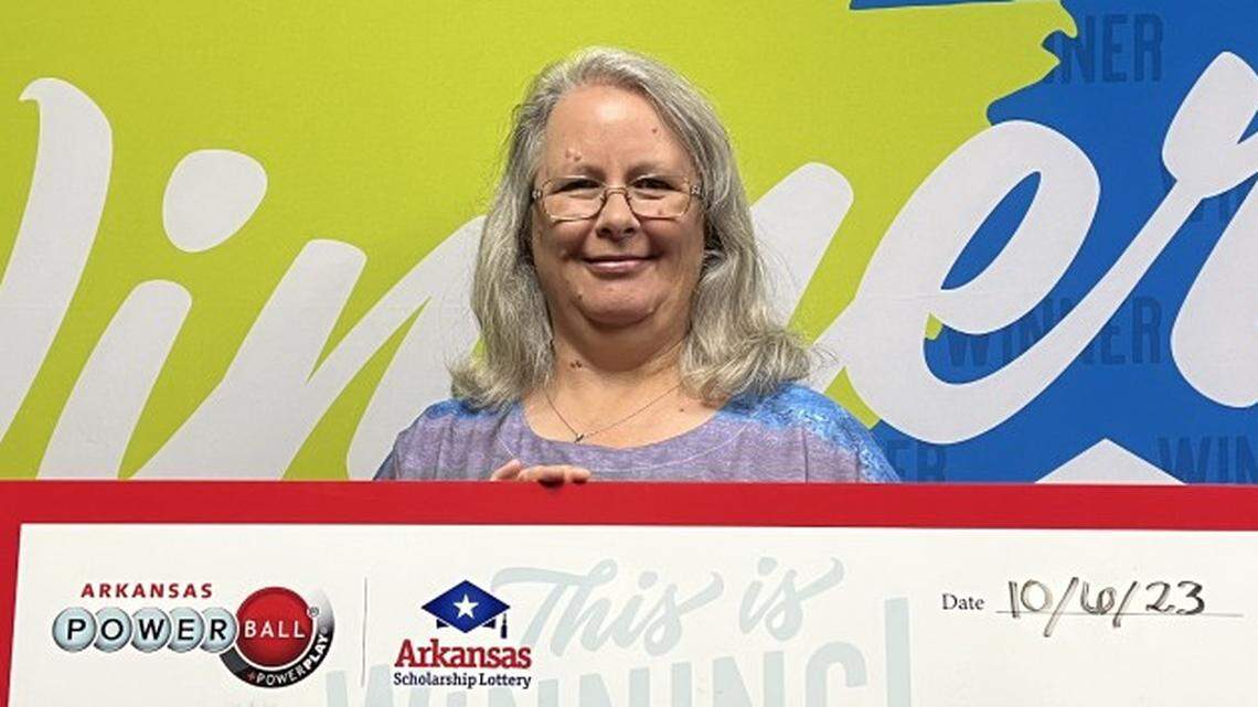 Billie Mooney with her oversized check.