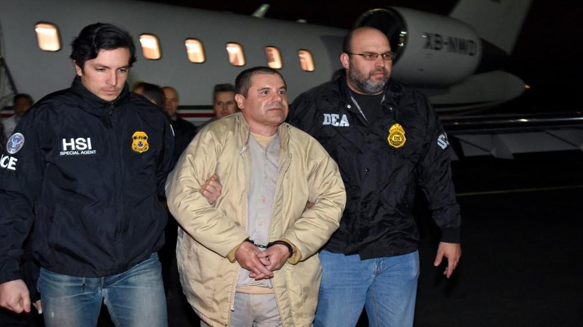 The infamous drug kingpin Joaquin "El Chapo" Guzman, center, who twice escaped from maximum-security prisons in Mexico was extradited at the request of the U.S. to face drug trafficking and other charges, and landed in New York late Thursday, a federal law enforcement official said.