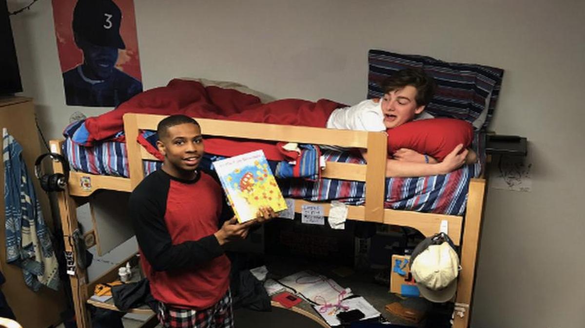 Andrew Kochamba (right), a freshman at the University of Tennessee, made a special birthday request of his dorm RA. He was surprised when Quamir Boddie came through and read him a bedtime story.
