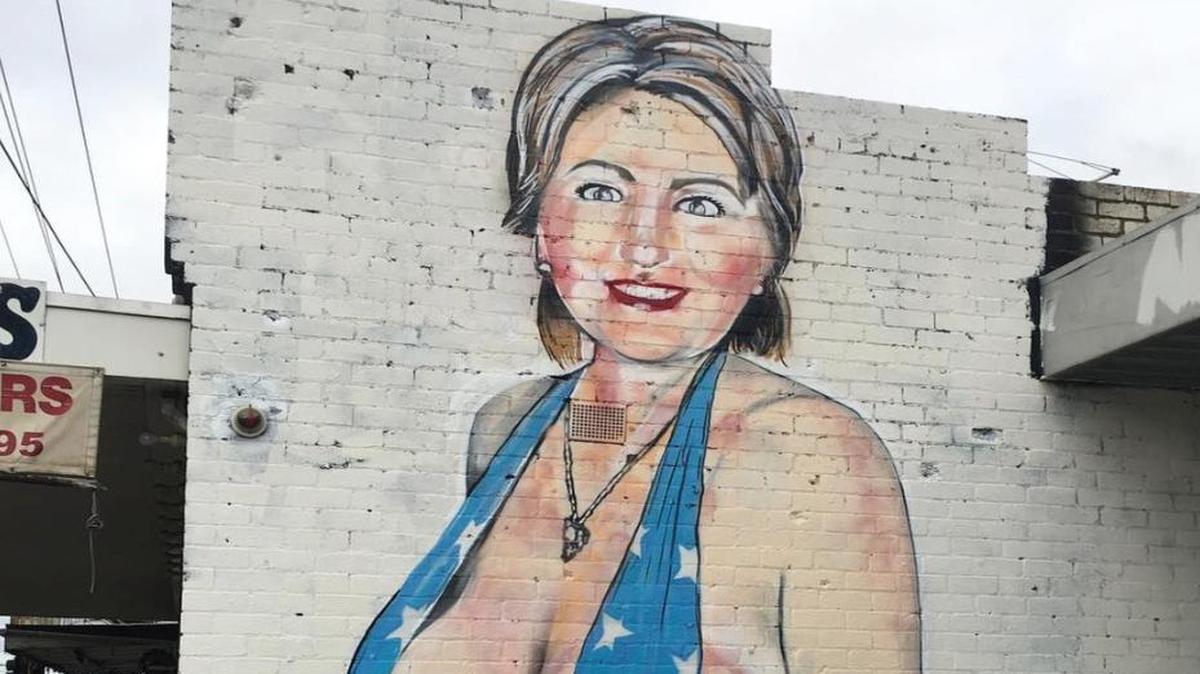 Australian street artist Lushsux painted this mural of Hillary Clinton in Melbourne, Australia, then covered the image with a black burqa when city officials complained. Instagram shut down his Instagram account when he posted this image to it.