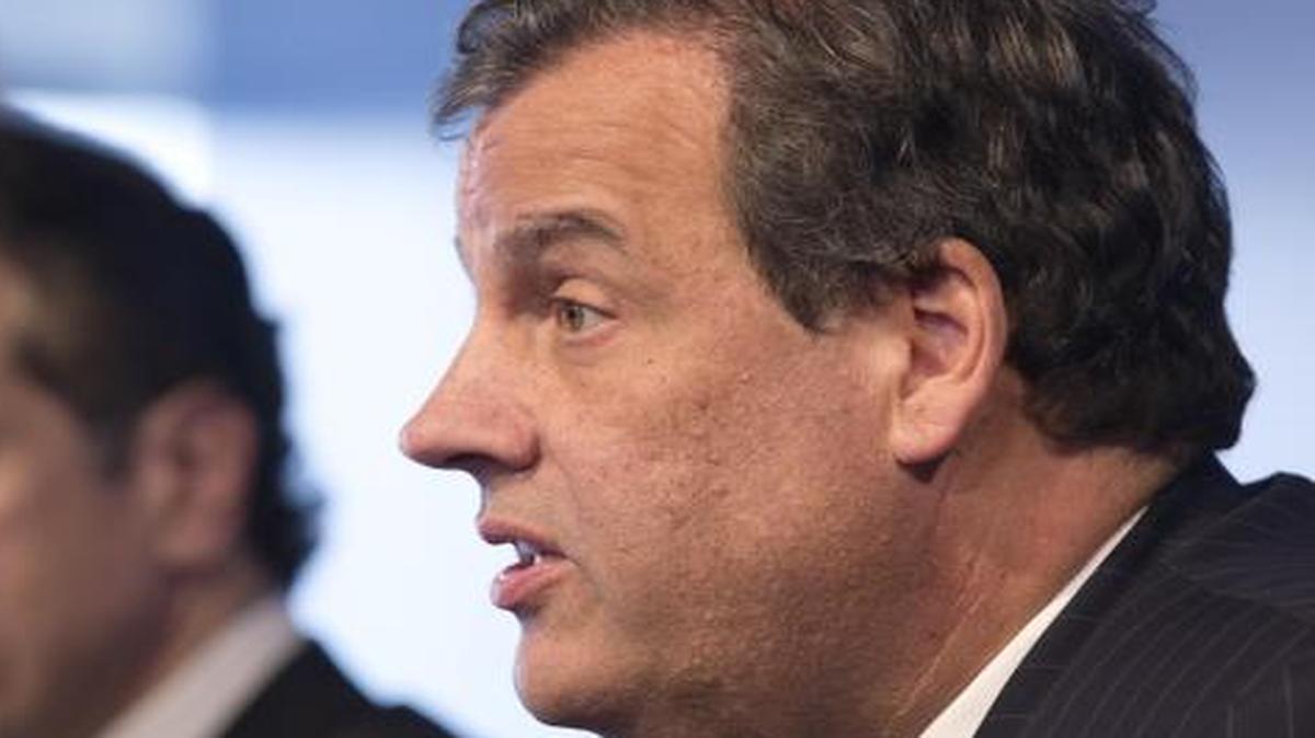 
New York Governor Andrew Cuomo, left, listens as New Jersey Governor Chris Christie talks at a news conference, Friday
