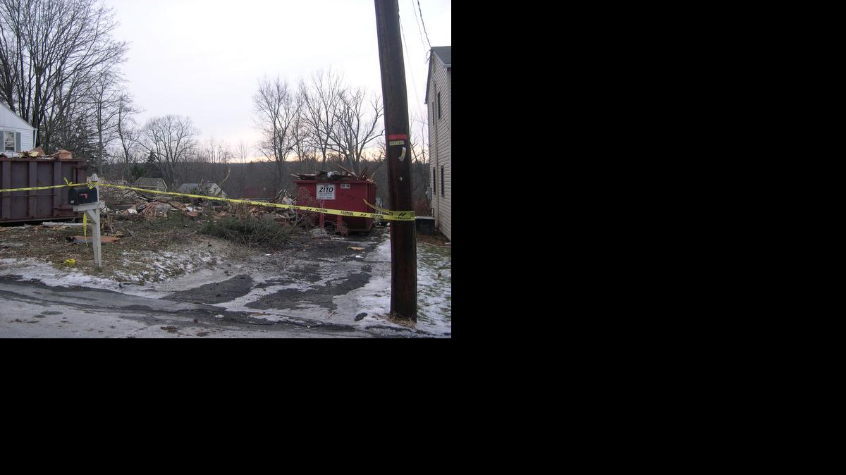 
Police rope off the area where a house once stood in Middletown, N.Y. on Wednesday,
