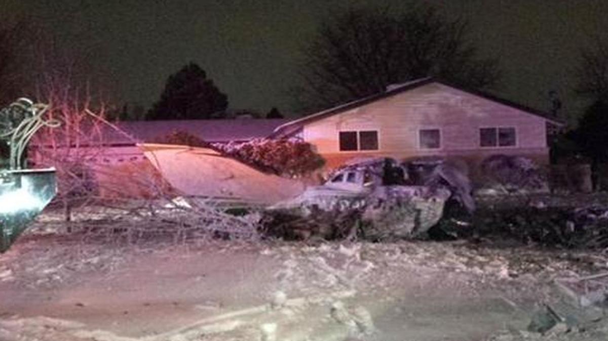 
The fuselage of a small plane lies in the front yard of a home in the south Denver suburb of Centennial, Colo.
