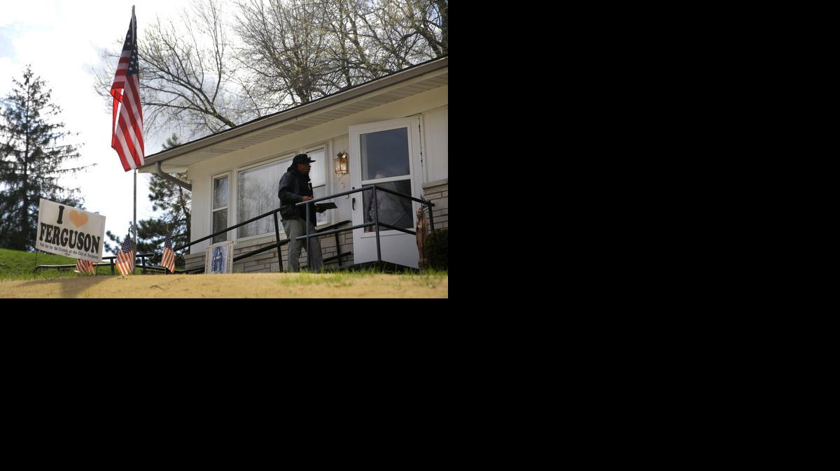 
Days before municipal elections, Reginald Rounds, a volunteer with the Organization for Black Struggle, talked to a potential voter Friday while canvassing a neighborhood in the St. Louis County suburb of Ferguson. Three of six seats on the City Council will be decided Tuesday.

