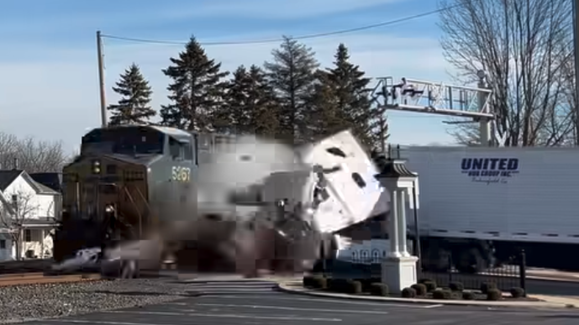 A train slammed into a semi truck that had stalled on tracks in Versailles, Ohio.