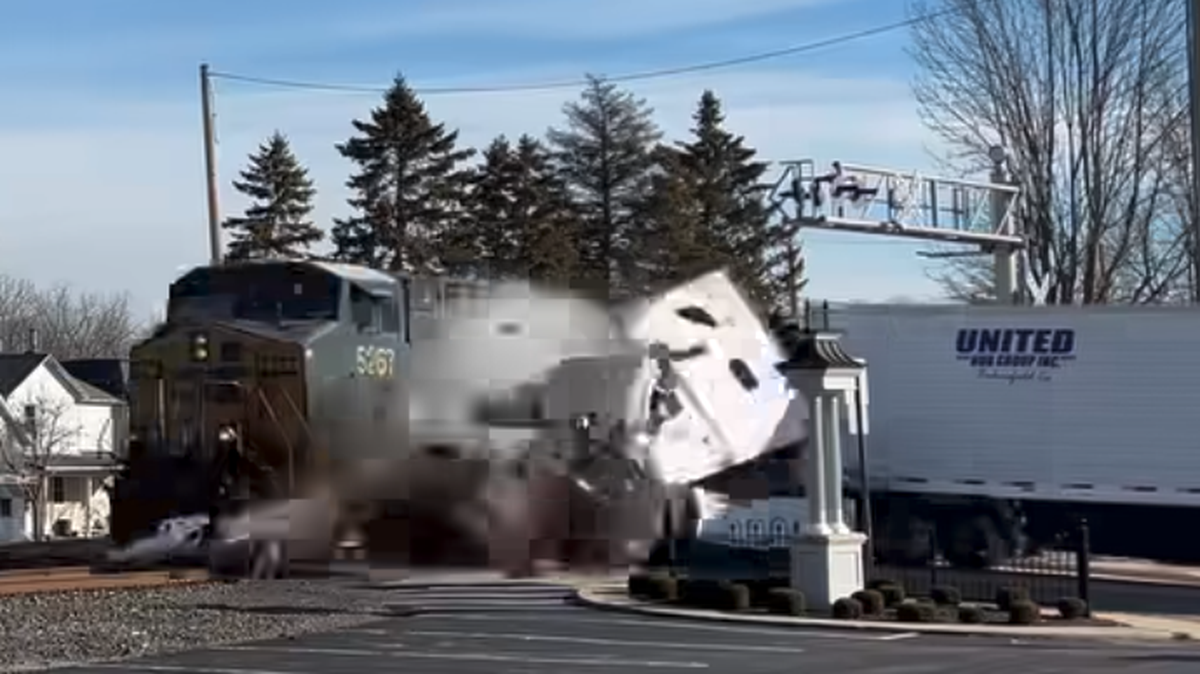 A train slammed into a semi truck that had stalled on tracks in Versailles, Ohio.