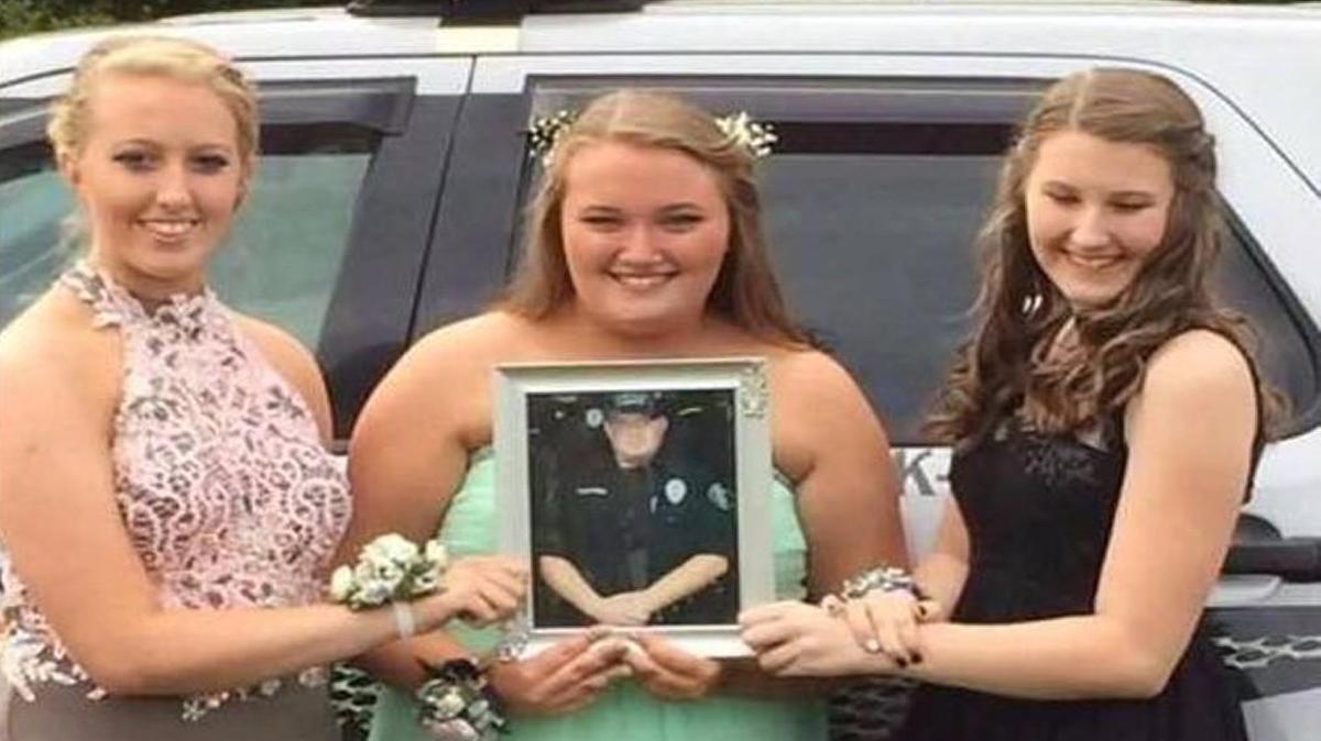 Courtney, Brooklyn and Alycia Cottrell of Newark, Ohio, went to their homecoming dance over the weekend escorted by colleagues of their late father, Officef Thomas Cottrell.