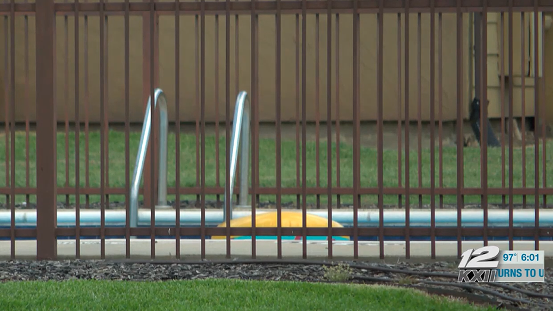 Two twin girls drowned in an apartment complex pool, police say.