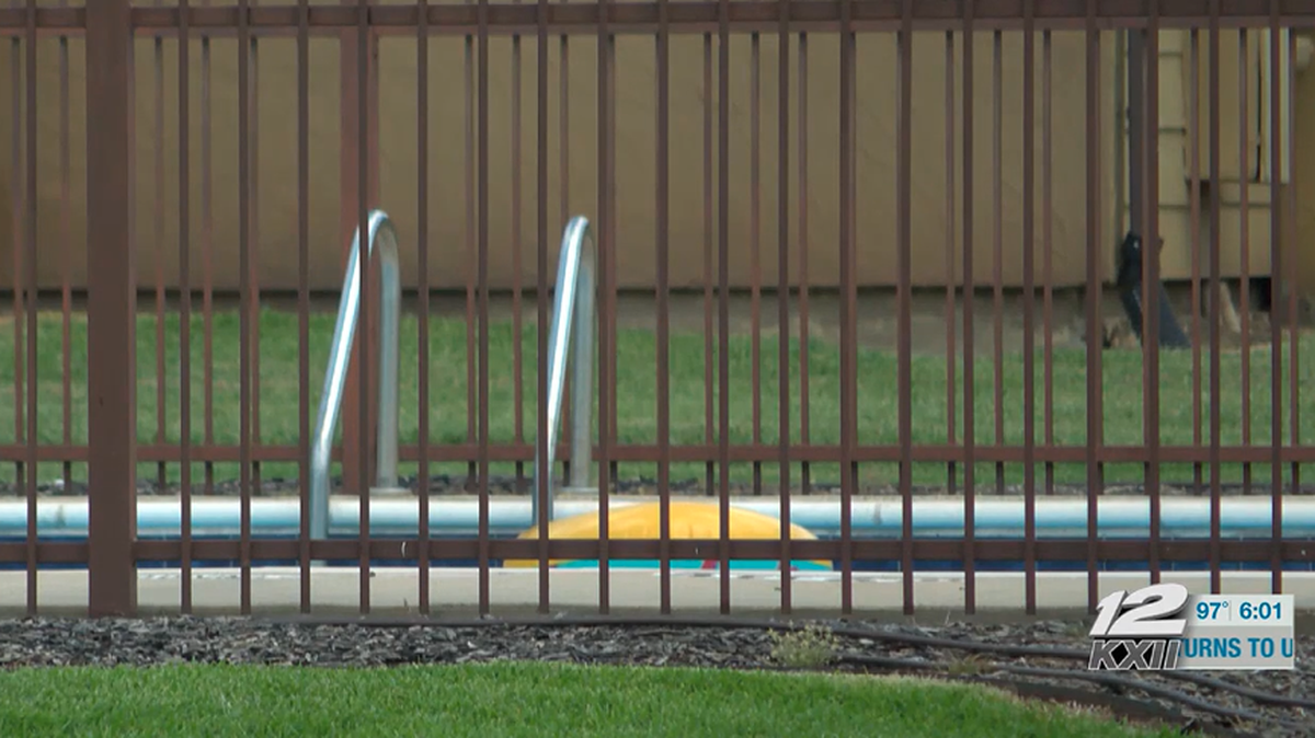 Two twin girls drowned in an apartment complex pool, police say.