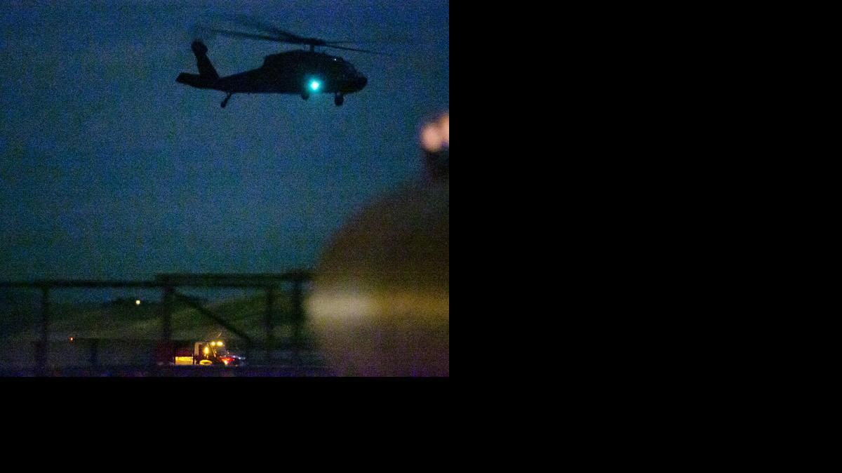 
An Idaho National Guard helicopter lifts off from a crash site where another Guard helicopter was reported to have crashed south of Gowen Field in Boise Thursday.

