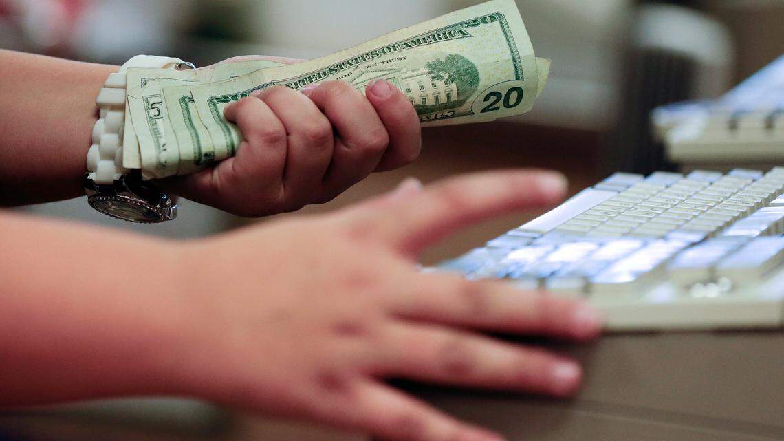 File photo - A man stole more than $109,000 by using sleight-of-hand and other ruses to trick cashiers into handing cash in 11 states, according to officials.