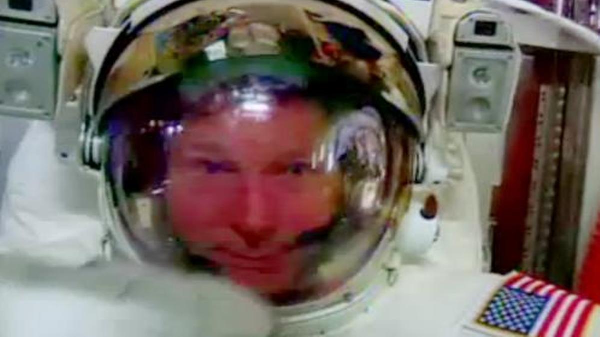 
Astronaut Terry Virts points to his helmet inside the International Space Station Wednesday
