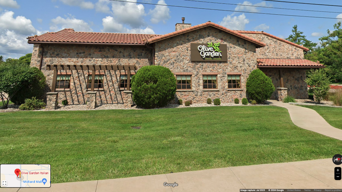 A man is in custody following the shooting of a 41-year-old woman at an Olive Garden in Midland, Michigan, cops say.