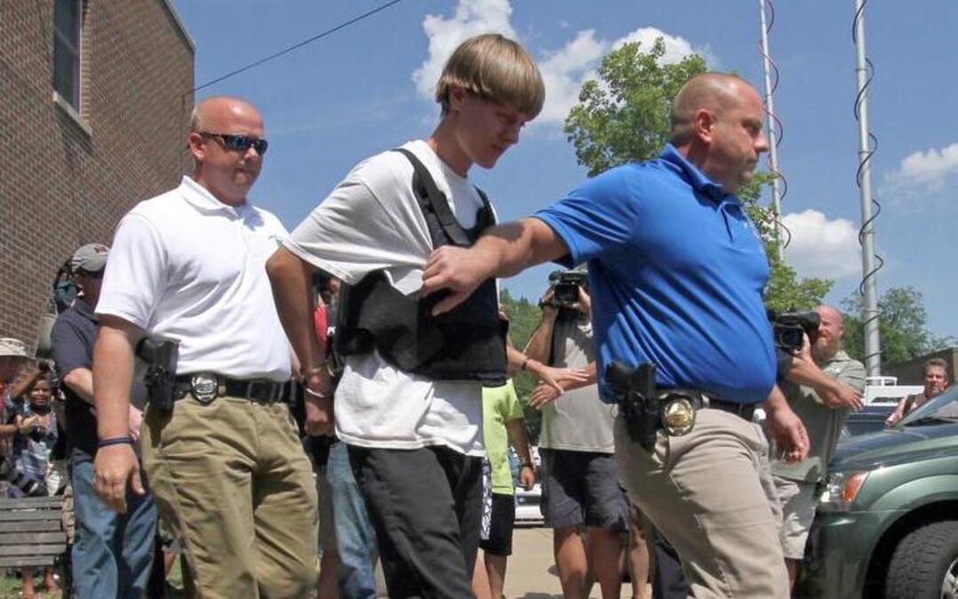 
Charleston, S.C., shooting suspect Dylann Roof was escorted from the Sheby Police Department in Shelby, N.C., on Thursday.
