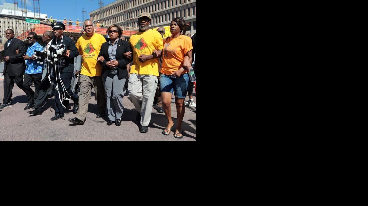 
Protesters locked arms and demanded justice for Michael Brown on Tuesday in a march through Clayton, Mo., the St. Louis County seat.
