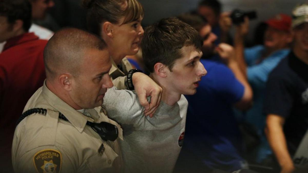 Police remove protestor Michael Steven Sandford as Republican presidential candidate Donald Trump speaks at the Treasure Island hotel and casino in Las Vegas. Sandford, a British man accused of trying to take a police officer's gun and kill Donald Trump during a weekend rally in Las Vegas, will not be released on bail.