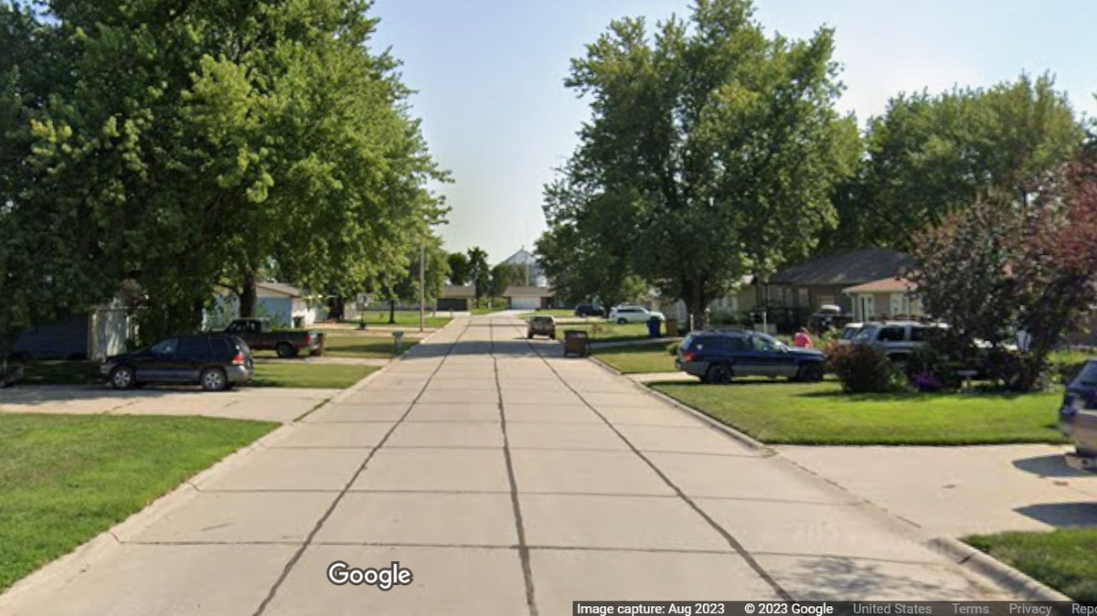 A Nebraska man was arrested after police say he stabbed three people, killing one, in an Aurora, Nebraska neighborhood.