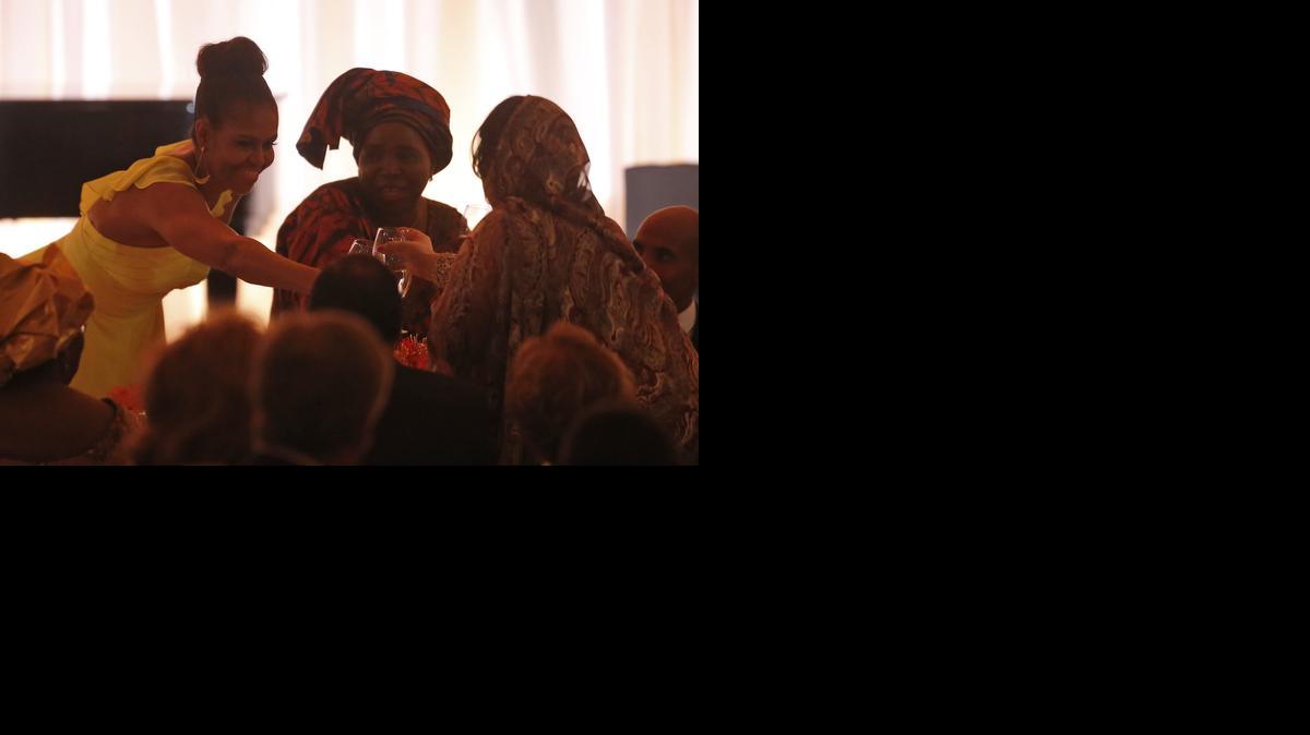 
First lady Michelle Obama offers a toast to guests after President Barack Obama offered a toast at a dinner for the U.S. Africa Leaders Summit, on the South Lawn of the White House Tuesday.
