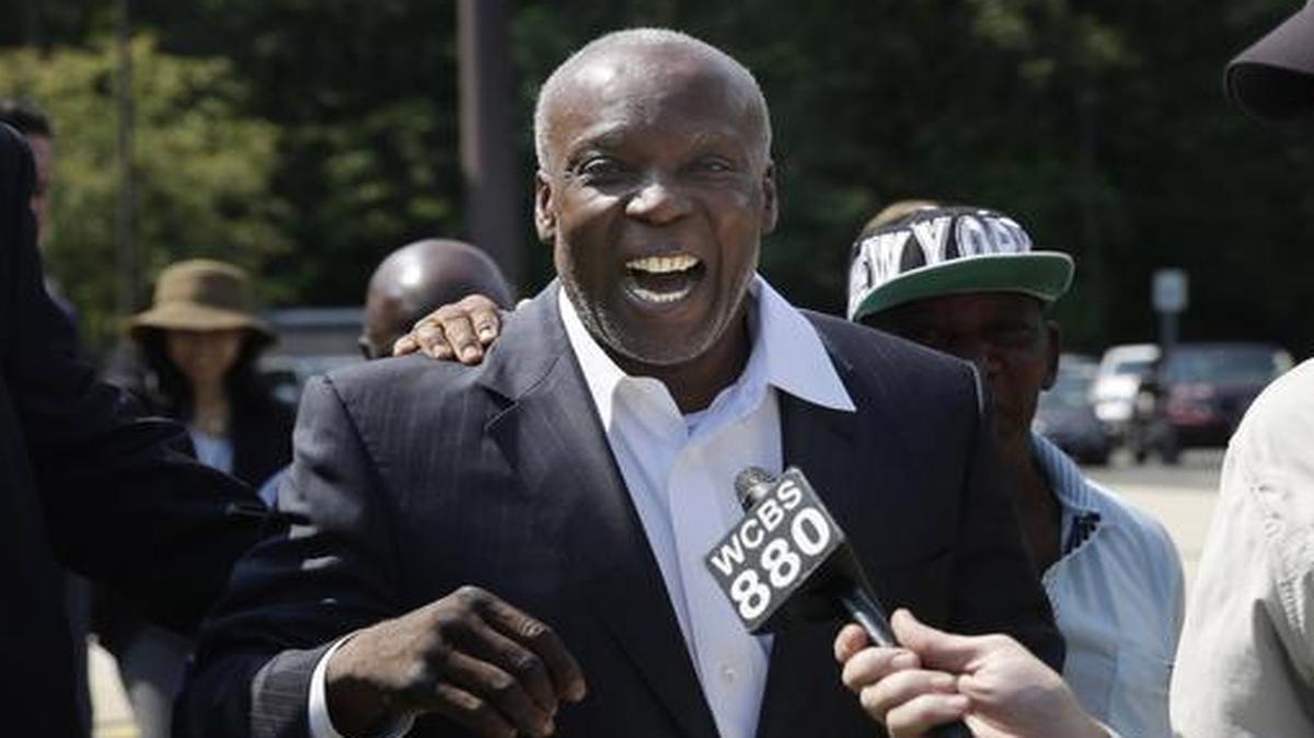 
Demeza Delhomme, the mayor of Spring Valley, N.Y., laughs as he makes his way to his car after being released from jail 
