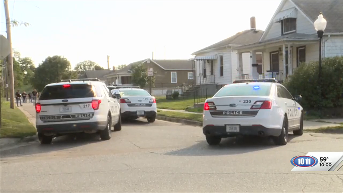 One man has been arrested after police say he opened fire on two caseworkers performing a welfare check.