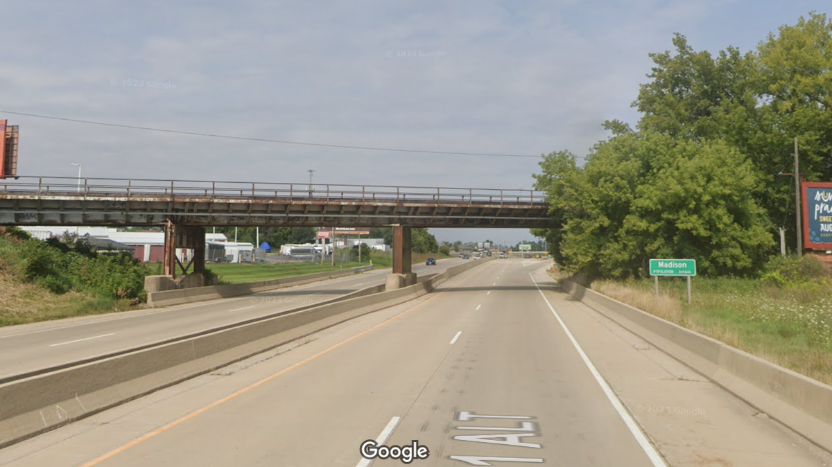 At least 18 vehicles were damaged by rocks dropped from a bridge onto a highway, Wisconsin police said. Two teenagers were taken into custody.