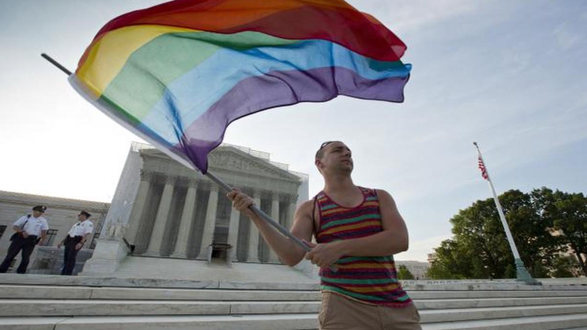 
Gay-rights advocate Vin Testa waved a rainbow flag in front of the U.S. Supreme Court in Washington in 2013.
