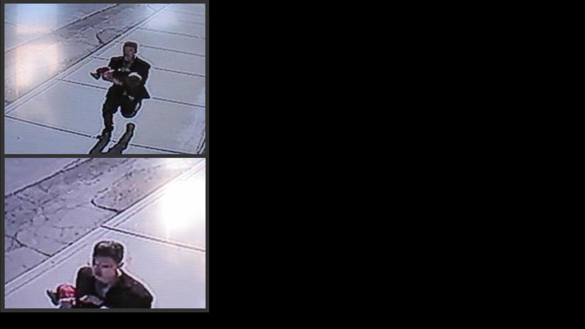 
In this combination of still images taken from surveillance video on Sunday, a man runs down a street carrying a toddler in an apparent kidnapping attempt in Sprague, Wash. 
