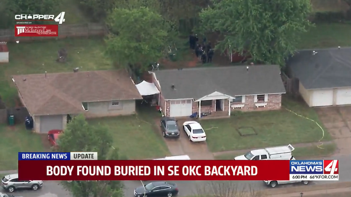 A man was arrested after a body was discovered buried in a home’s backyard, police say.