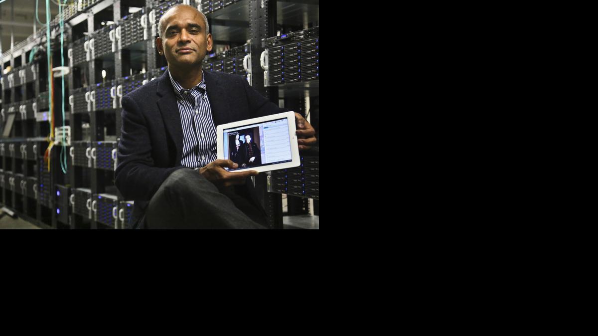 
Chet Kanojia, founder and CEO of Aereo, Inc., holding a tablet displaying his company's technology, in New York
