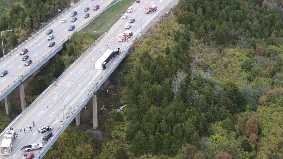A Kentucky woman is dead after her pickup truck was pushed off a bridge when multiple vehicles collided on a highway.
