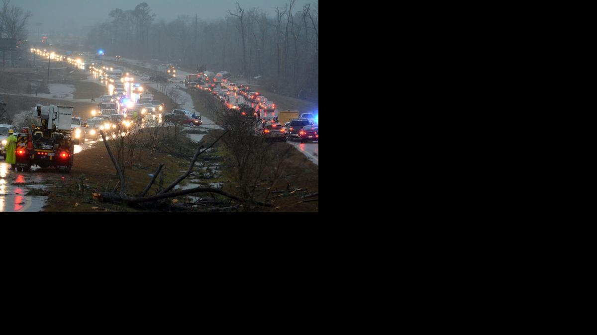 
Traffic is blocked on US 98 East near Columbia, Miss., after a tornado touched down around 2:30 p.m., Tuesday
