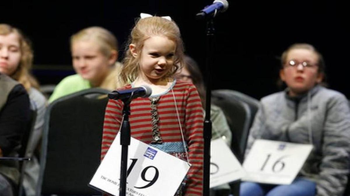 Edith Fuller, 5, spelled a word during the 2017 Scripps Green Country Regional Spelling Bee in Tulsa, Okla. Fuller is bound for the Scripps National Spelling Bee after becoming the youngest winner of a regional competition.