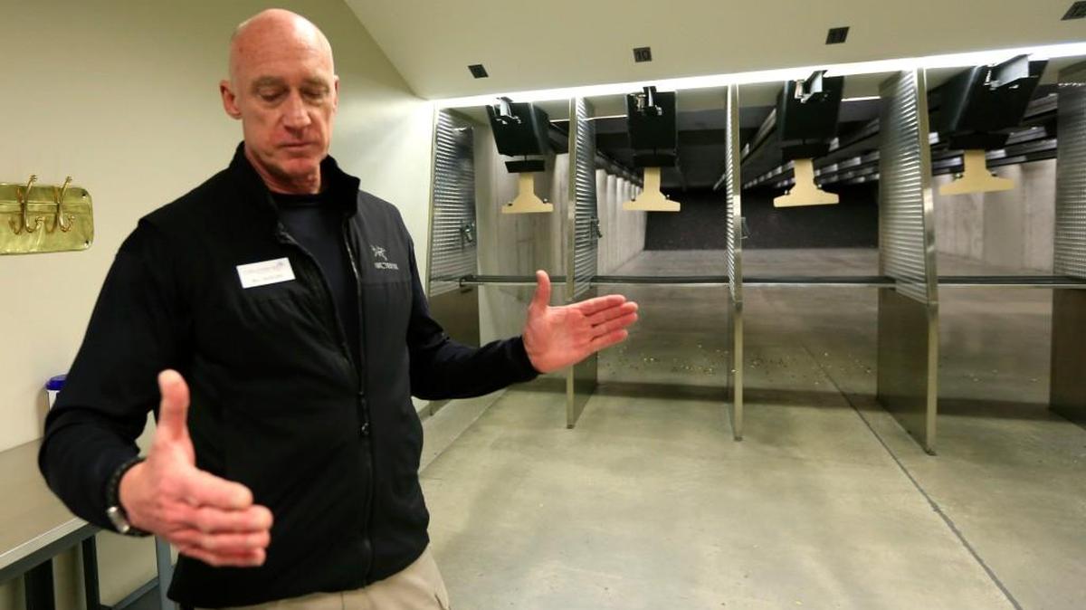 William Basore, co-owner of Centerfire Shooting Sports in Olahte, talks during a tour of his shooting range and firearms company Monday. Basore said he tried to insure his new car under a commercial policy he was originally given while running a construction company, but that he was denied coverage last fall because of his gun business.