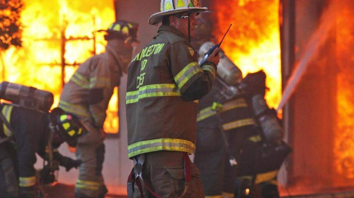 Chief Rusty Thomas directed firefighters battling the fire that destroyed the Sofa Super Store in Charleston, S.C., on June 18, 2007. Nine firefighters were killed.