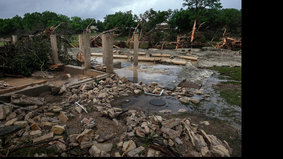 
The cement stilts of the home belonging to the Carey family of Corpus Christi, Texas, are all that remain after the home was swept away by the Blanco River early Sunday morning during a flash flood in Wimberley, Texas. 

